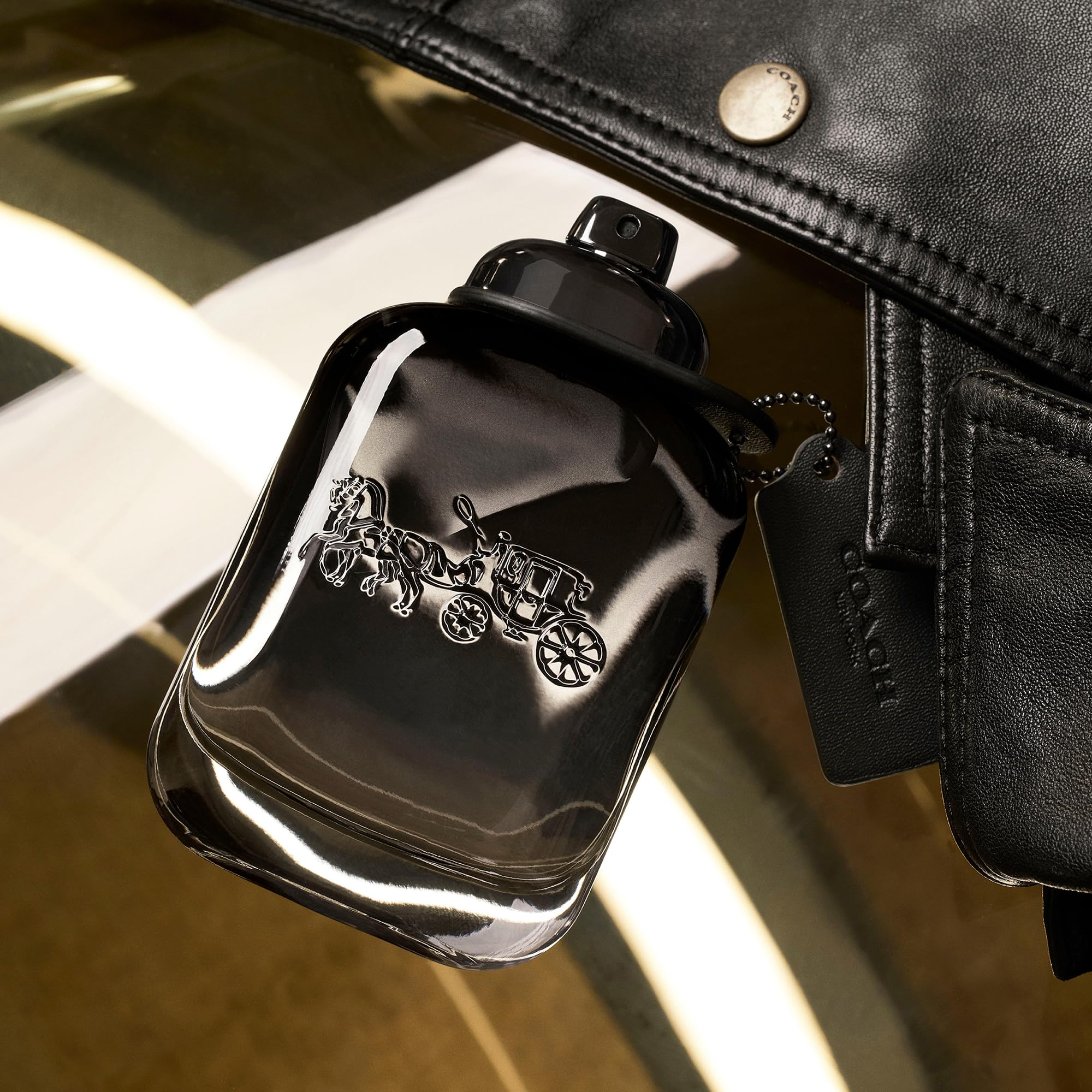 Close up shot of the spray nozzle on Coach for Men Eau de Toilette bottle