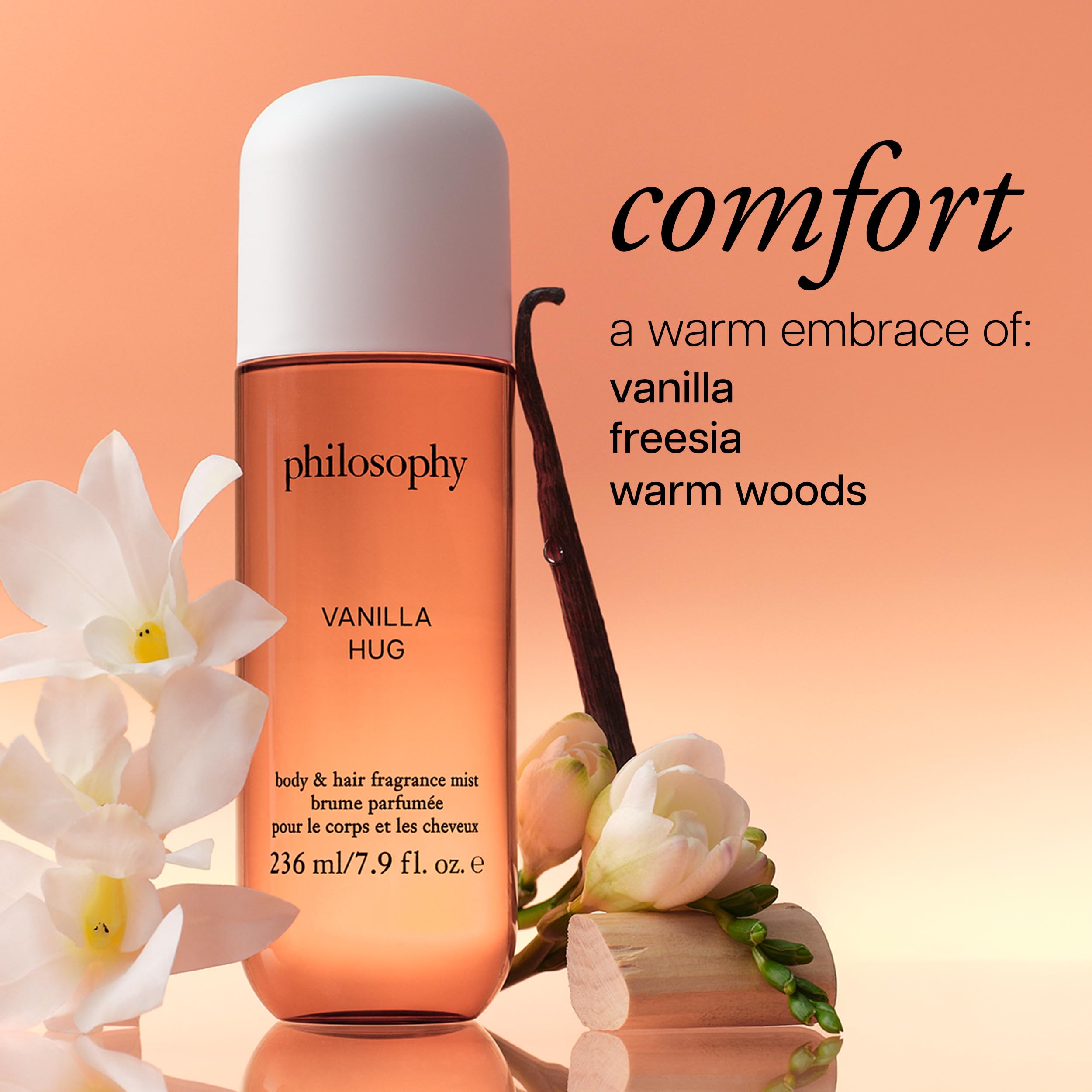 Philosophy hair and body mist bottle with white cap showcasing orange tint.