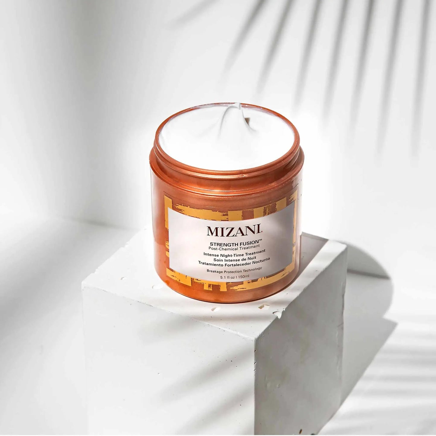 Mizani professional salon strength fusion cream for curly and damaged hair types.