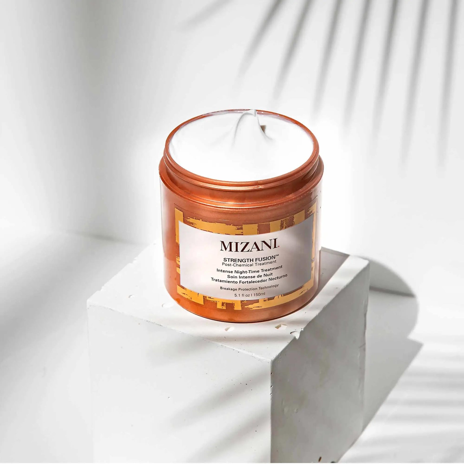 Mizani professional salon strength fusion cream for curly and damaged hair types.