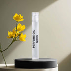 Back label of MIRIS perfume oil showing manufacturing details and ingredients.