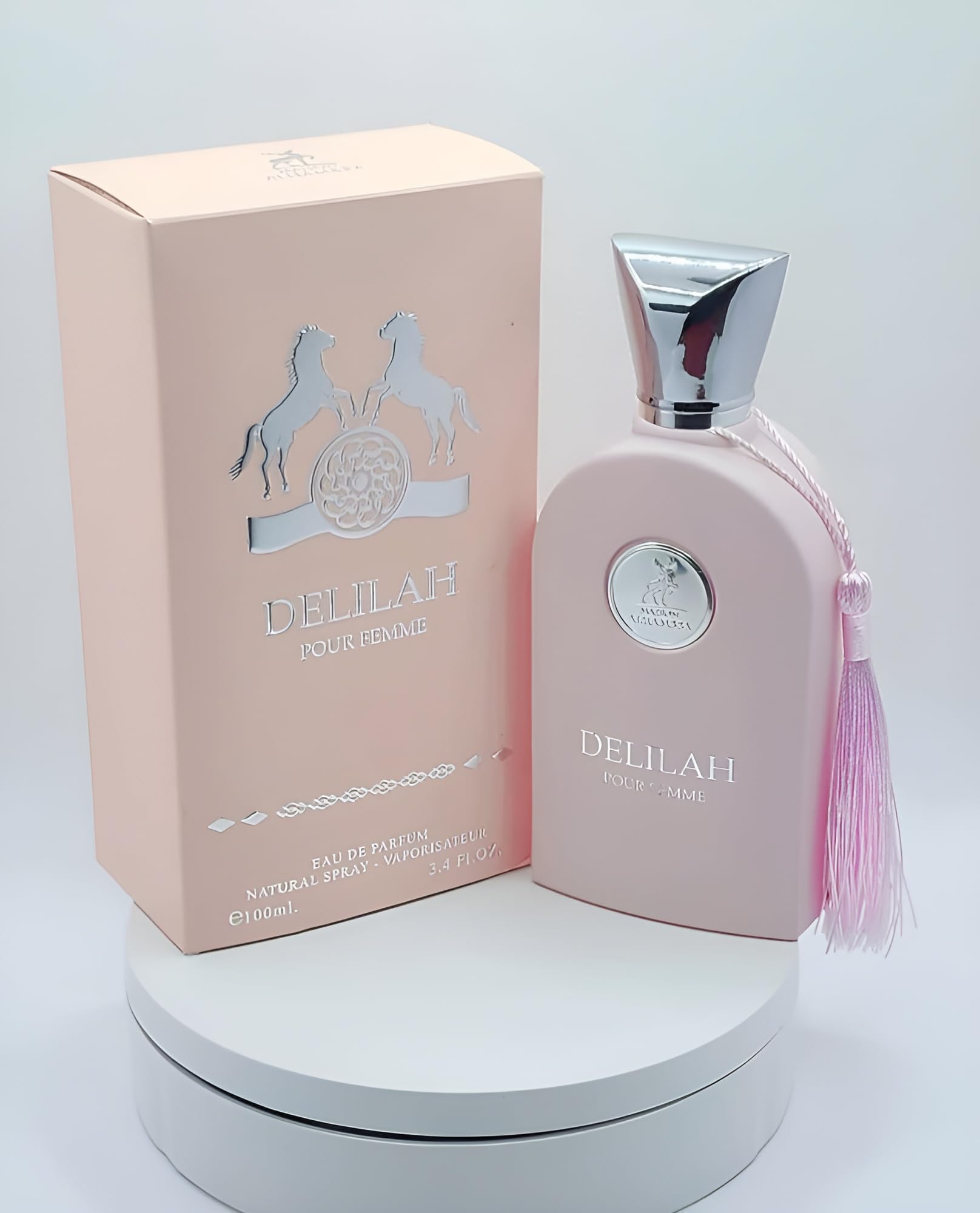 Close-up of the perfume packaging design highlighting the feminine details and premium typography.