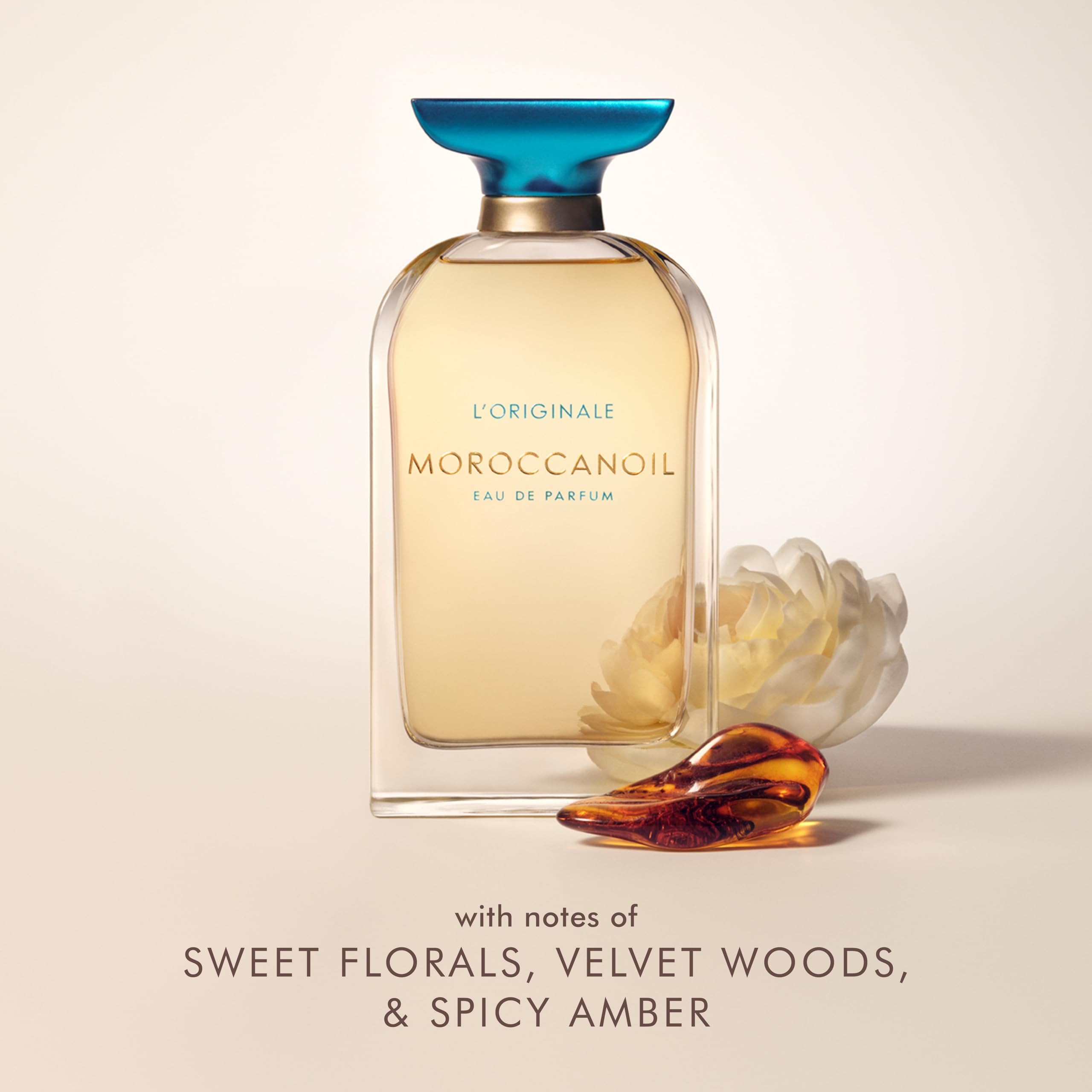 Moroccanoil signature scent luxury perfume spray bottle on a clean background.