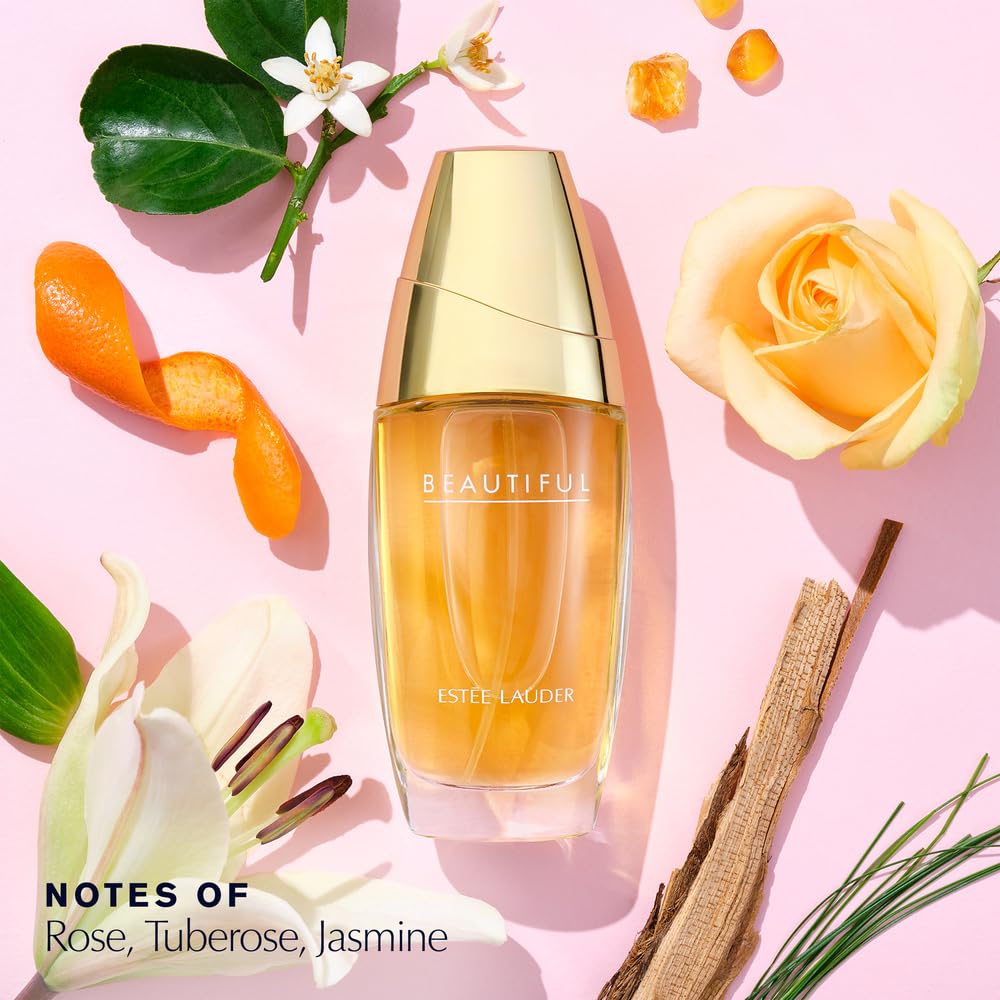 Estée Lauder Beautiful floral women perfume bottle showing the gold cap and clear glass detailing