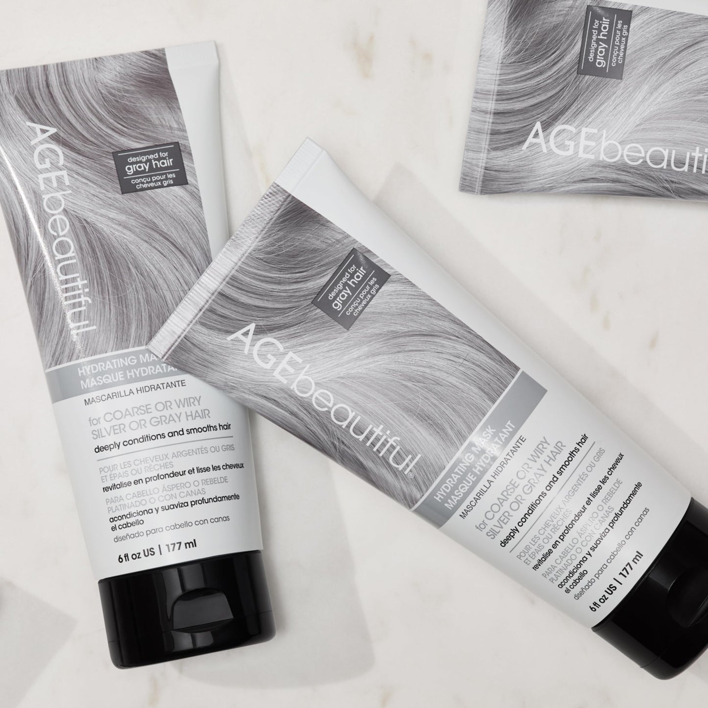 Texture shot of the rich white cream formula of AGEbeautiful hair mask for frizz control
