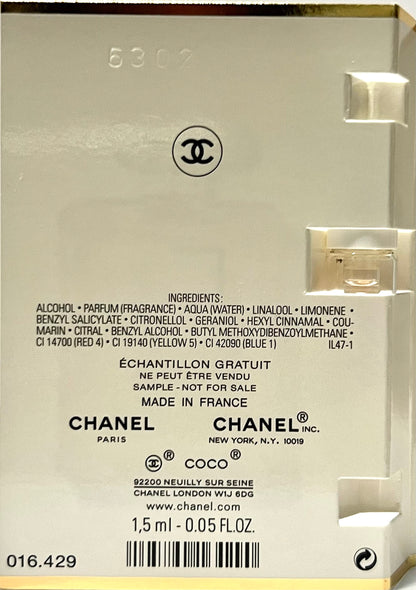 Chanel travel size fragrance spray for women on a flat lay background