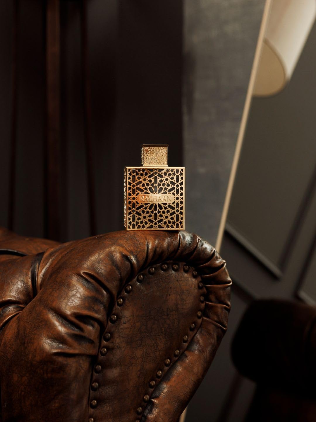 Rayhaan Elixir Eau de Parfum 3.4 Ounce collectible bottle showing the rich liquid through the gold cage detail.