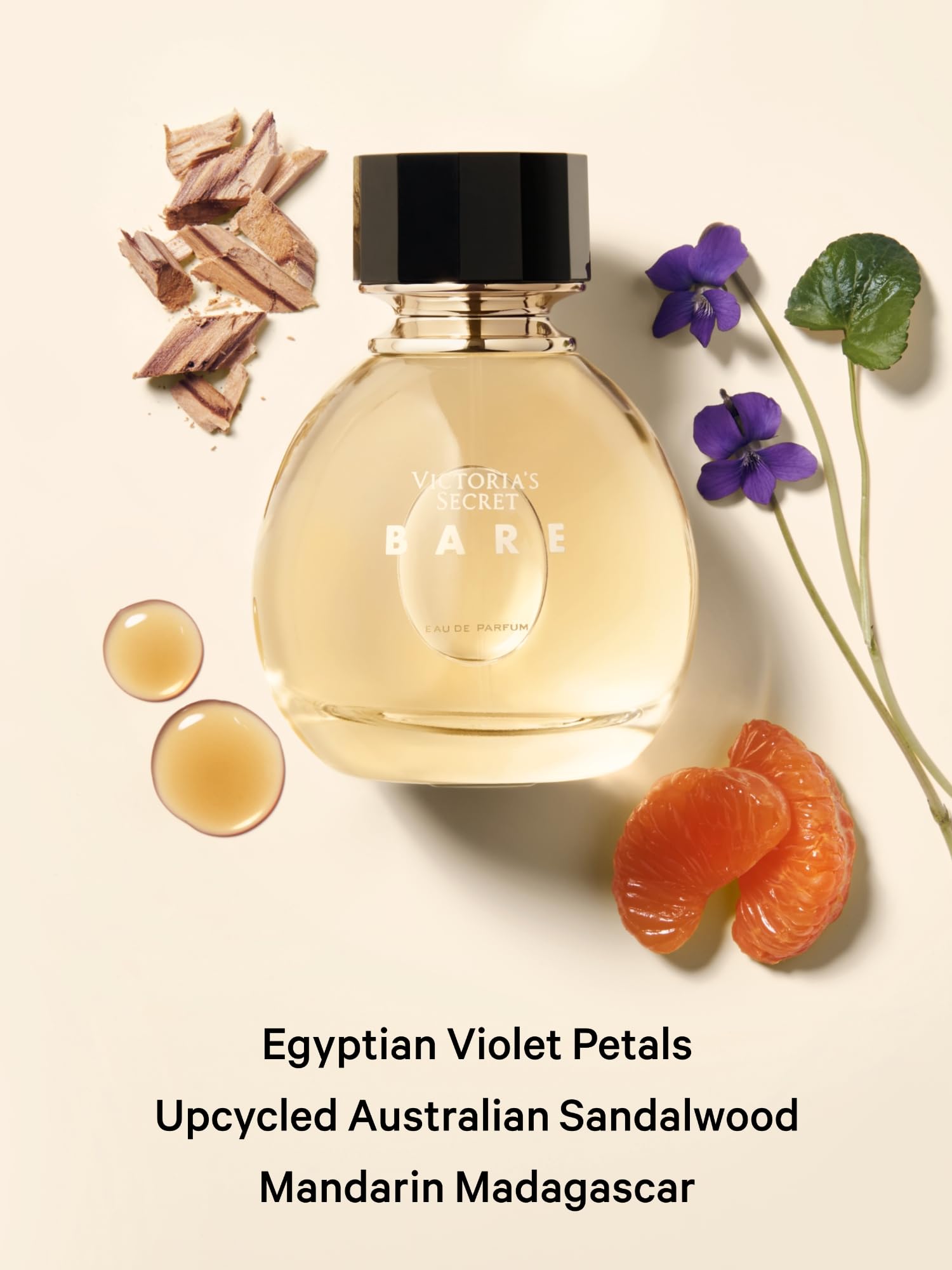 Victoria's Secret Beauty Bare fragrance bottle showcased against an elegant backdrop emphasizing its premium woody floral essence.