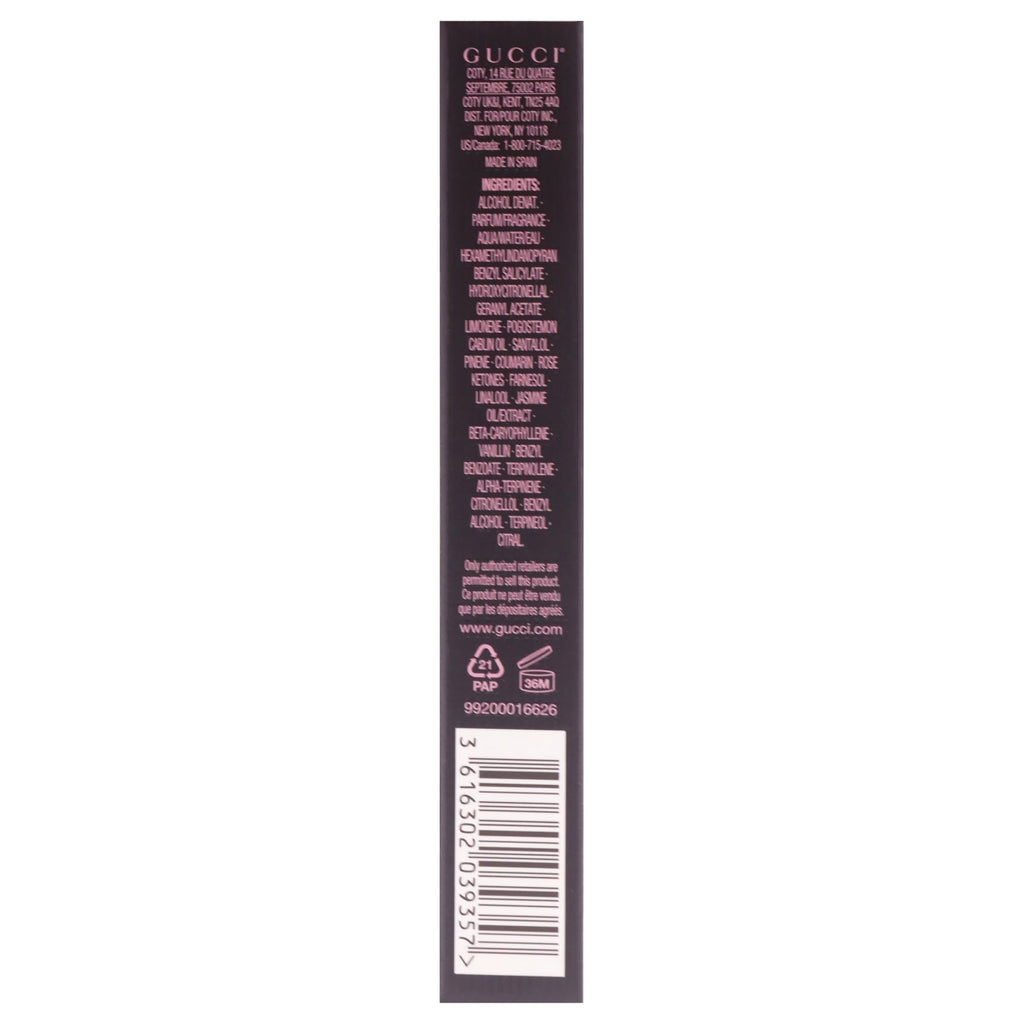 Gucci luxury floral fragrance travel spray held in hand showcasing its portable size.