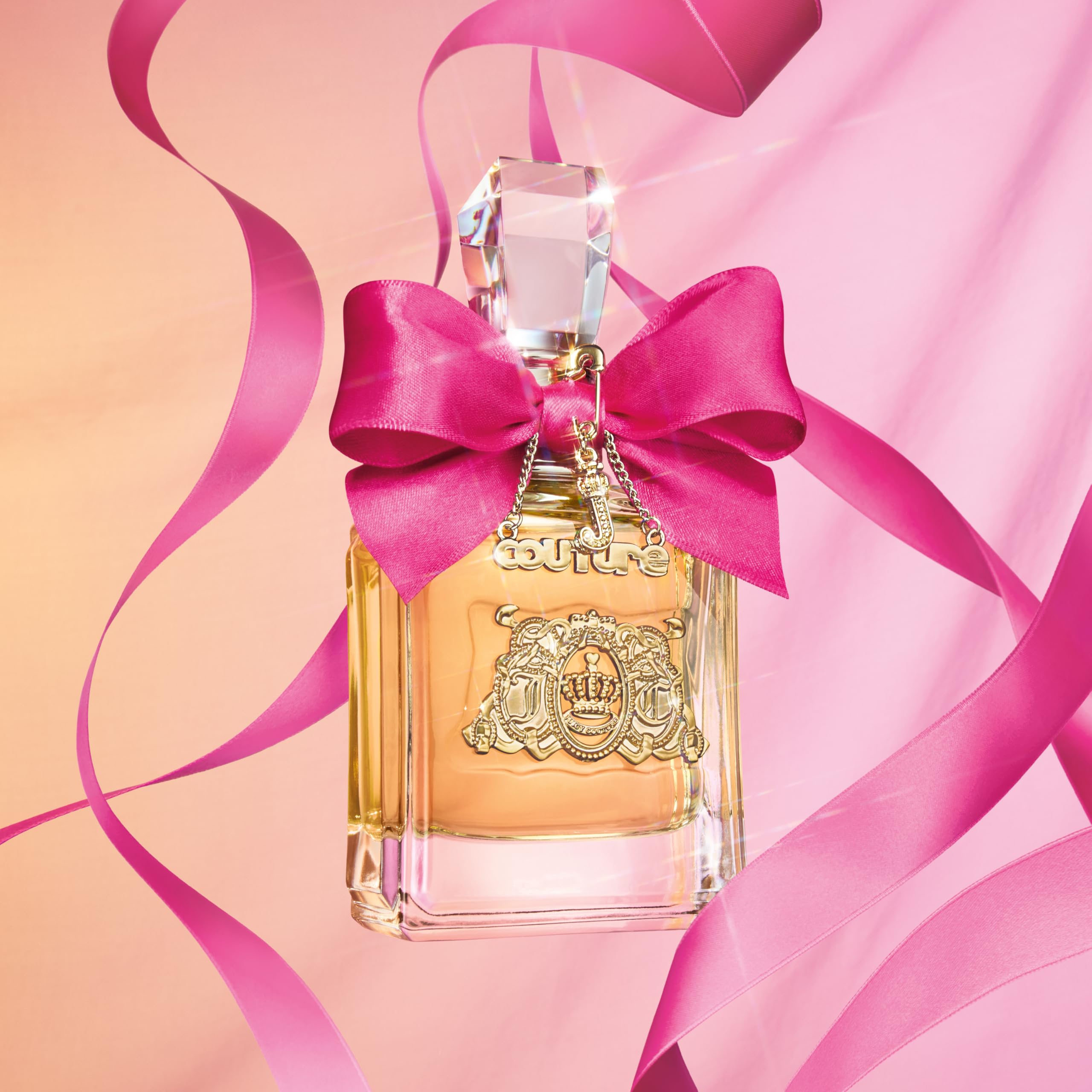 Juicy Couture Eau De Parfum spray mechanism and crystal cap close up