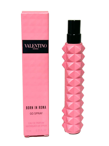 Valentino Donna Born In Roma ten milliliter travel perfume held in hand to demonstrate compact size