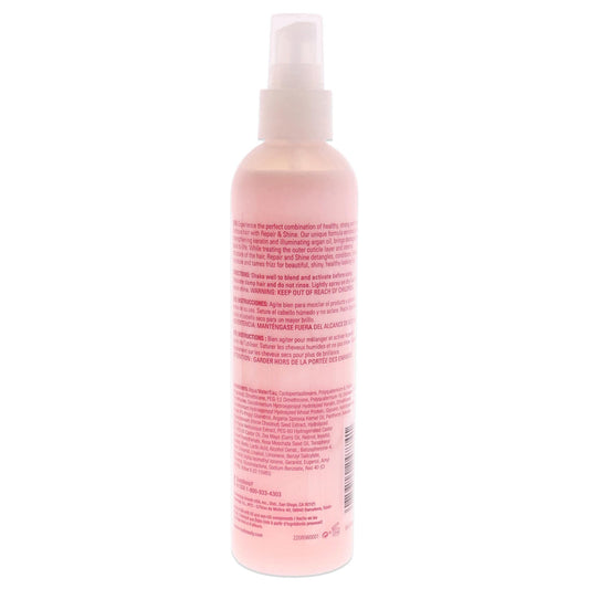 Close up shot of Roux Argan Oil Keratin hair treatment spray displaying product details and usage directions