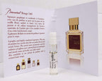 Authentic mfk Baccarat Rouge 540 miniature perfume bottle out of its packaging on a clean background.