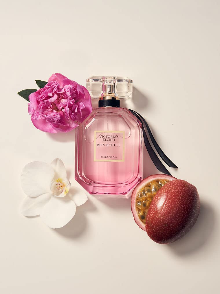 Victoria's Secret Bombshell perfume box packaging next to the signature luxury bottle for authenticity verification.