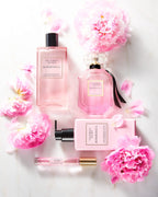 Victoria's Secret Bombshell standard 1.7 Ounce liquid volume size bottle held to demonstrate scale and design.