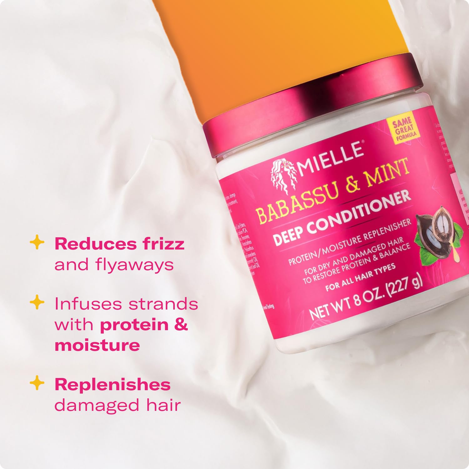 Texture shot of white creamy Mielle Organics babassu oil and mint conditioning cream