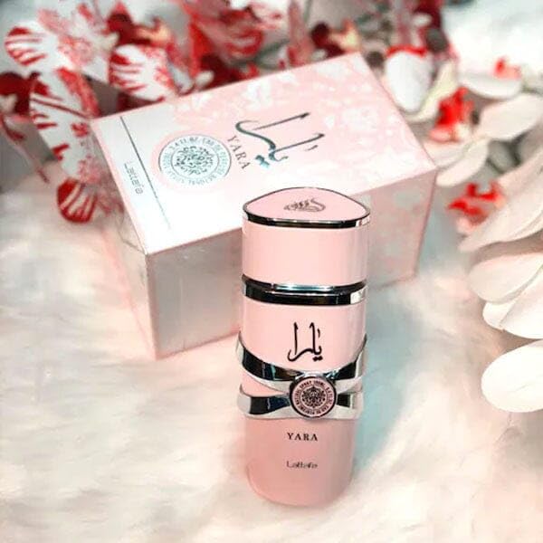 Authentic pink 100ml fragrance bottle with signature metallic embellishments