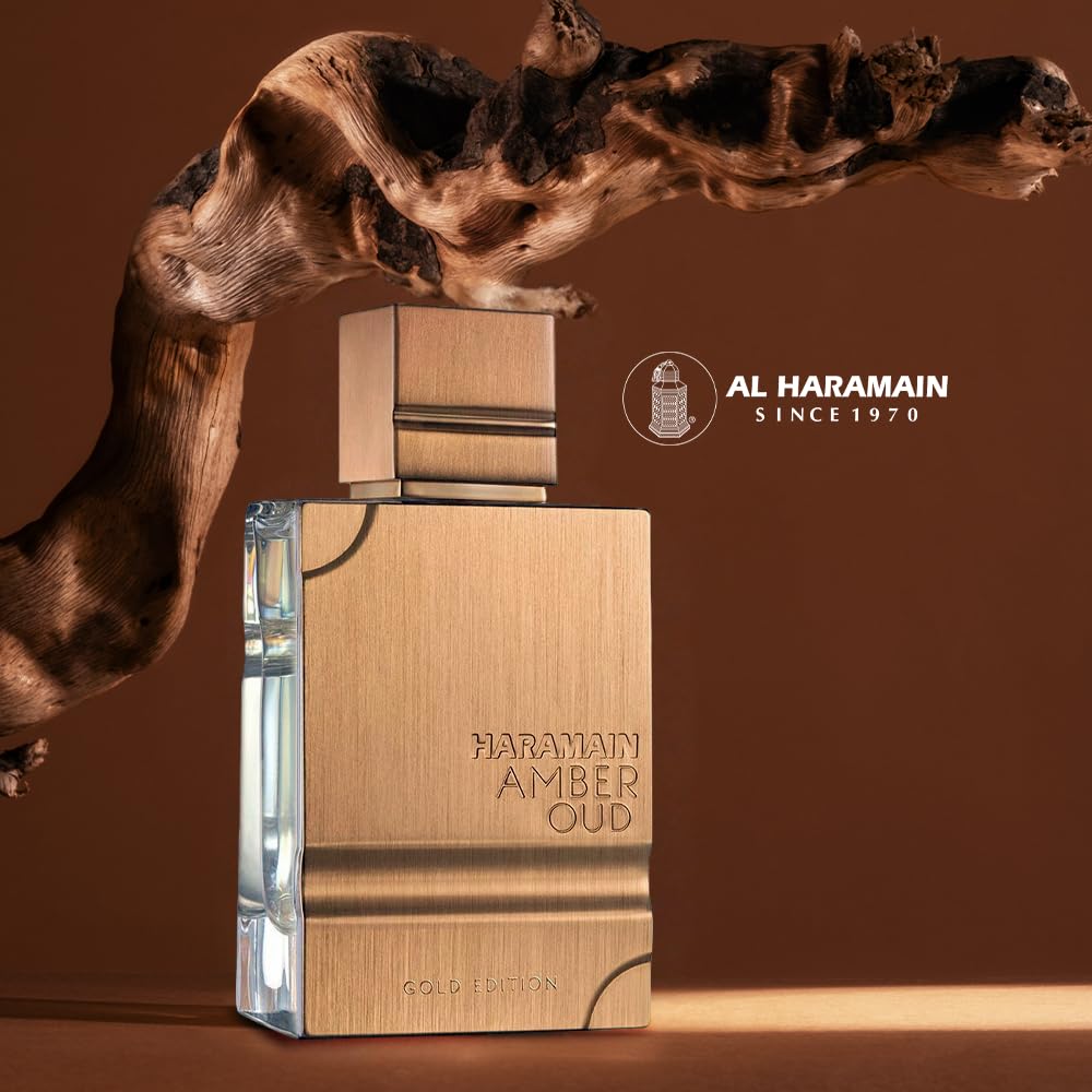 Al Haramain Amber Oud Gold Edition unisex luxury Arabian perfume next to its elegant gold presentation box