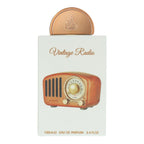 Lattafa Pride Vintage Radio luxury unisex perfume bottle standing next to its authentic retail packaging box