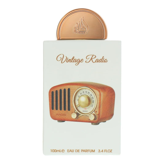 Lattafa Pride Vintage Radio luxury unisex perfume bottle standing next to its authentic retail packaging box