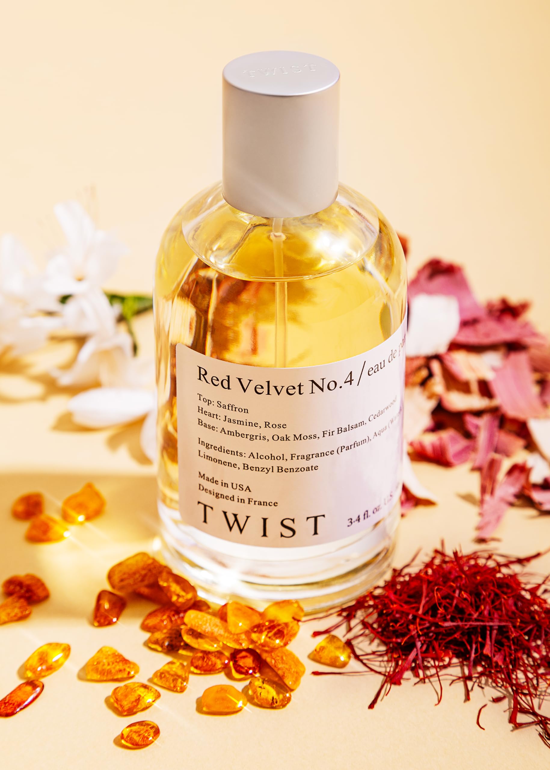 House Of Twist Red Velvet Number Four perfume bottle alongside saffron and cedarwood elements