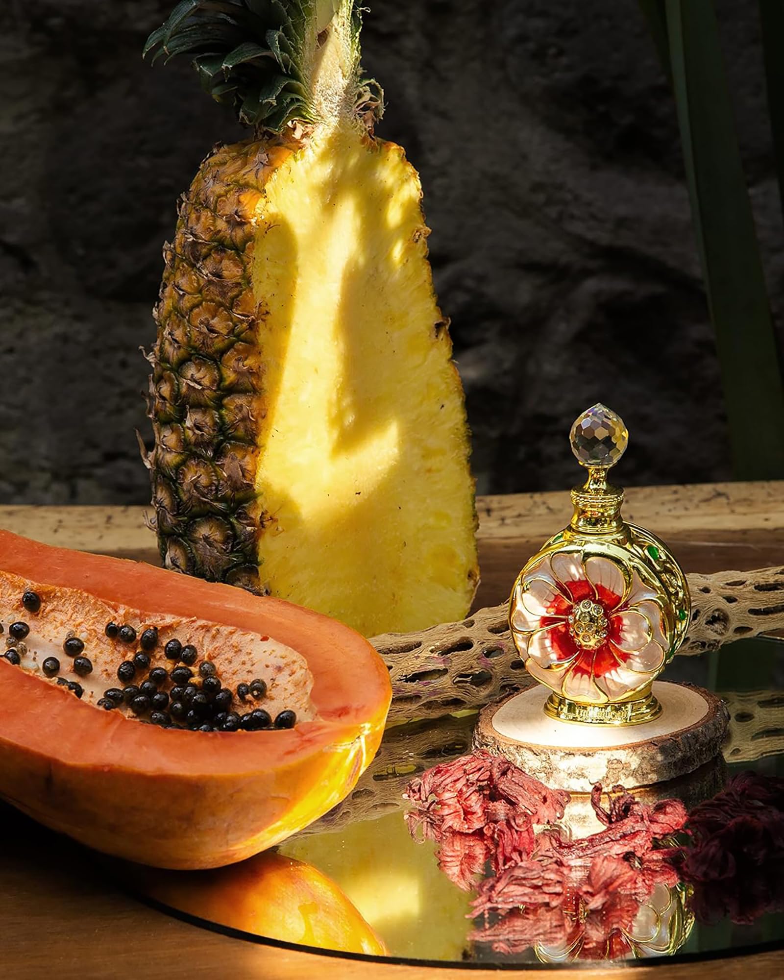 Side profile of the ornate Swiss Arabian Layali Rouge luxury perfume oil bottle highlighting the detailed floral craftsmanship.