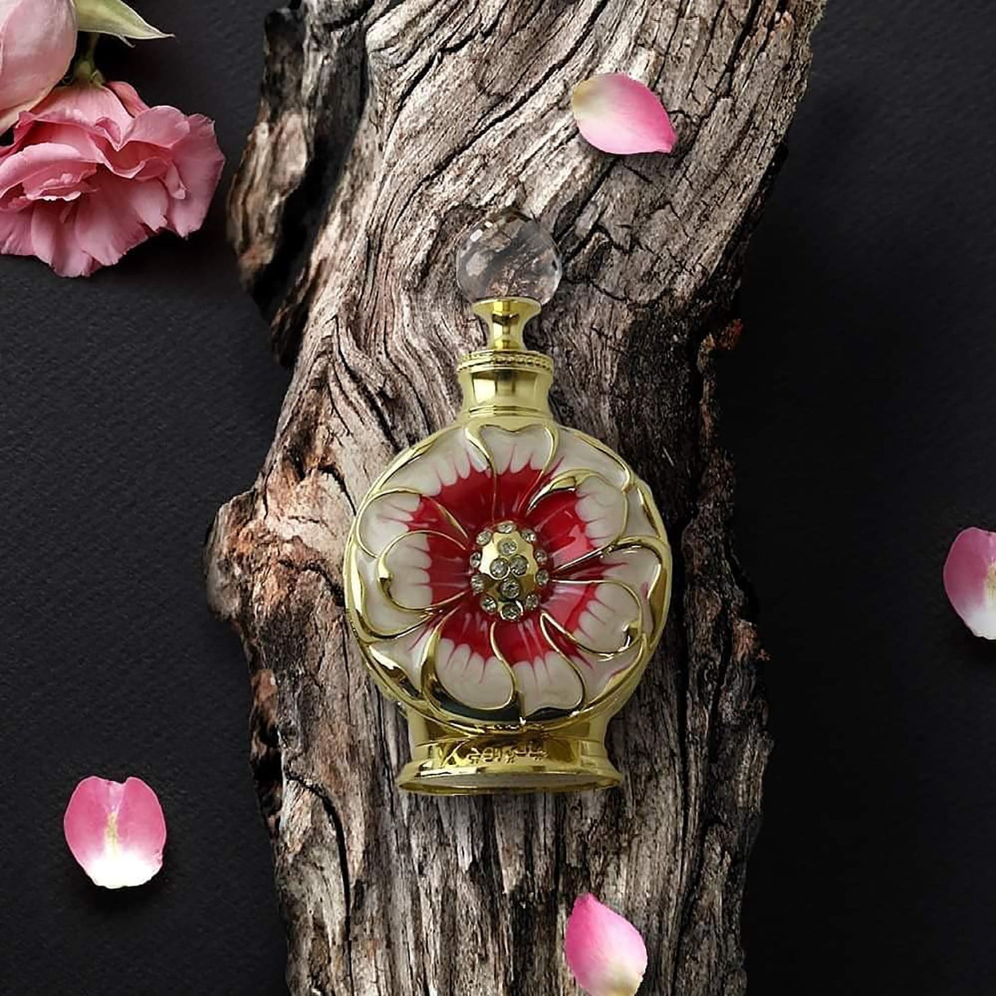 An overhead view of the authentic Swiss Arabian Layali Rouge floral fruity gourmand perfume oil bottle.