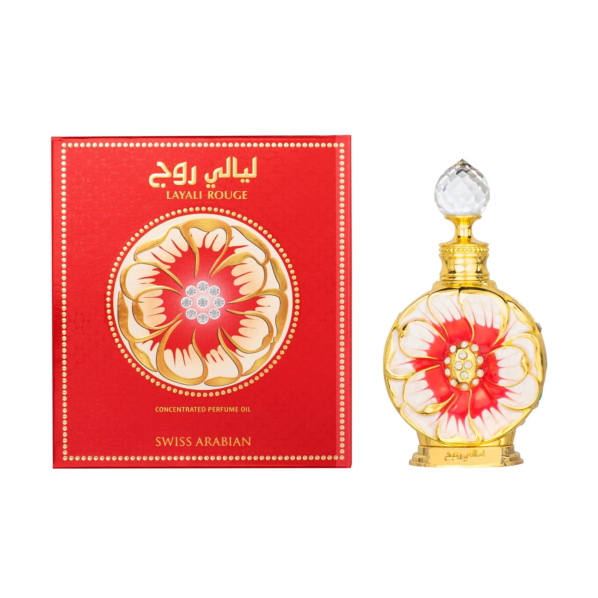 A scale shot of the travel friendly zero point five Ounce Swiss Arabian Layali Rouge alcohol free perfume oil bottle.