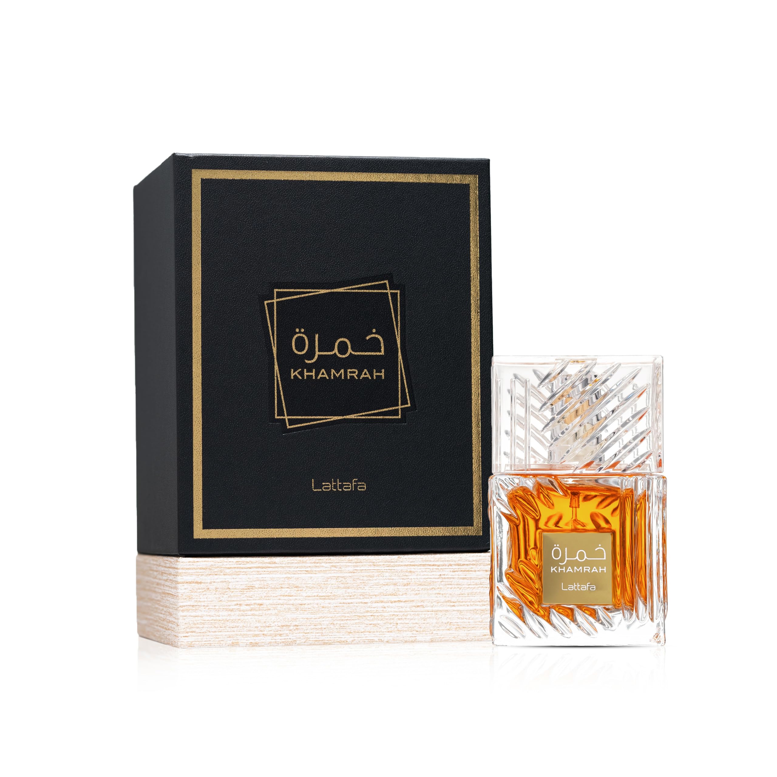 Lattafa Khamrah premium unisex perfume standing upright next to its elegant retail packaging box.