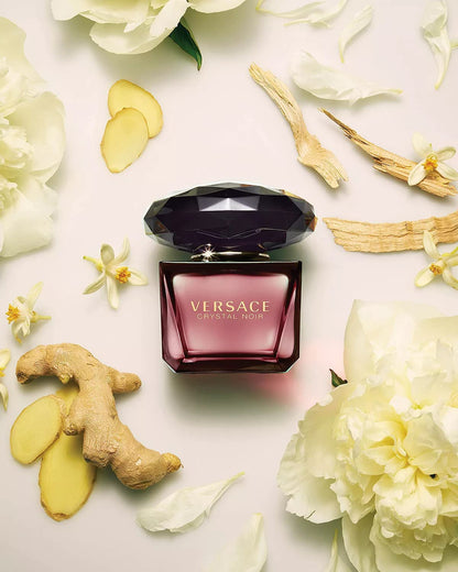 Close up of dark red Versace Crystal Noir fragrance bottle
