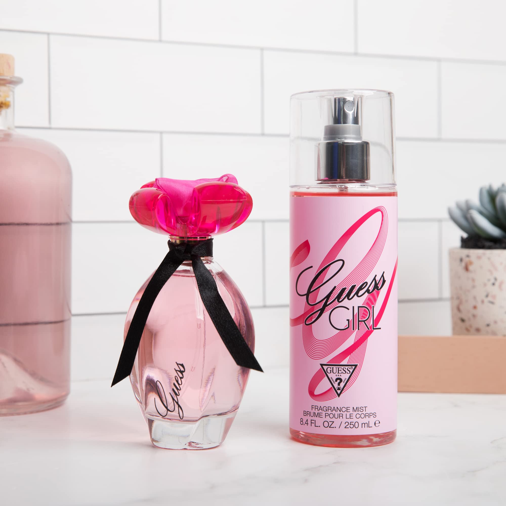 Guess Girl fragrance pink cap design close up