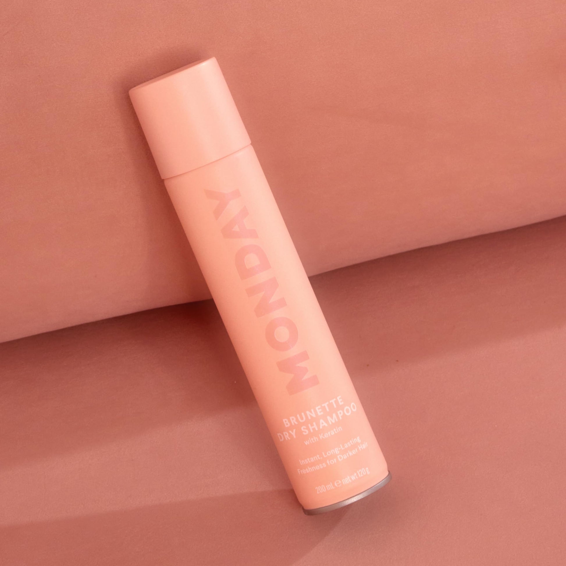 Lifestyle shot of Monday Haircare Brunette Dry Shampoo for daily use