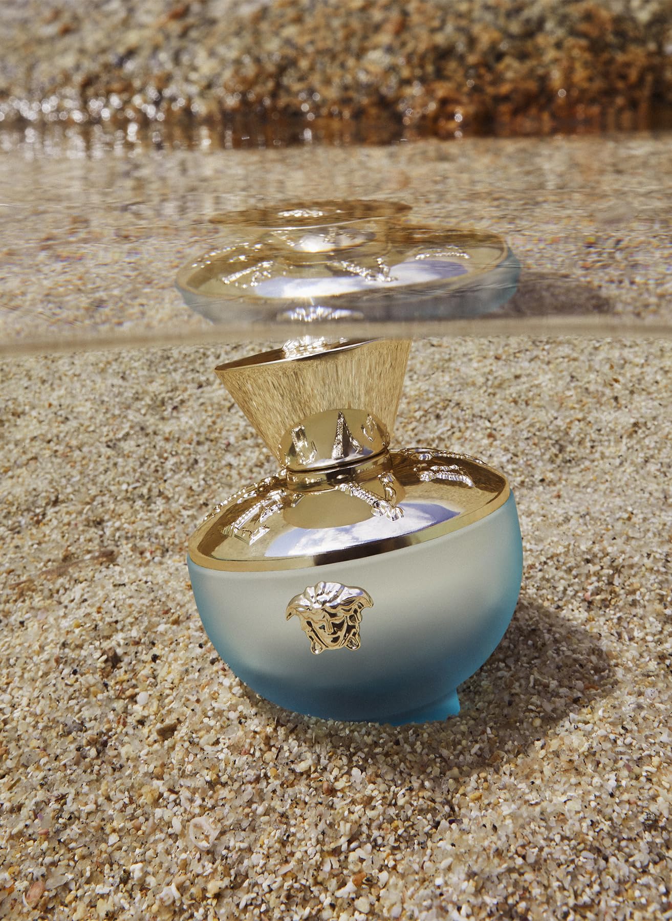 Versace Dylan Turquoise perfume bottle on display