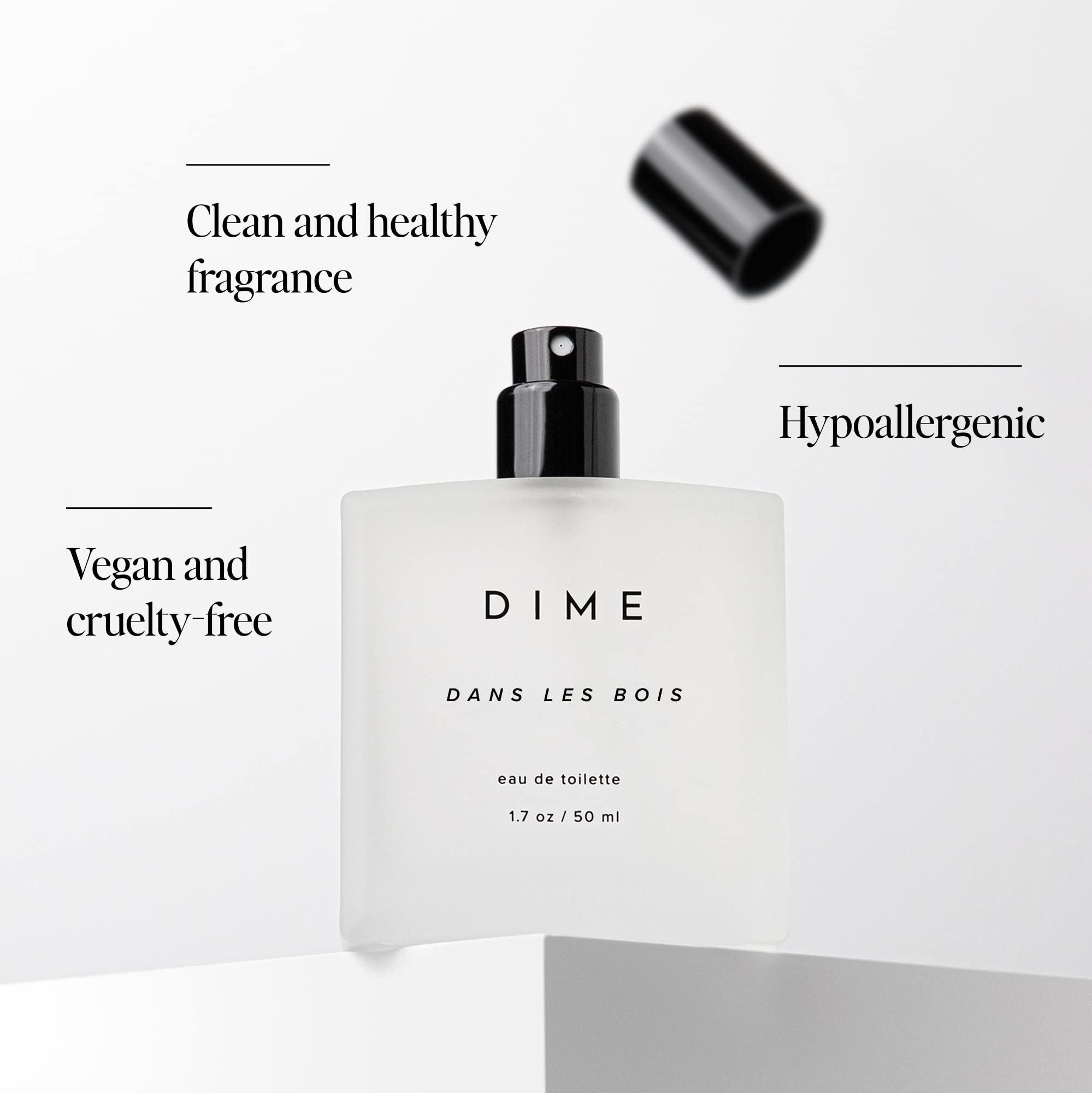 DIME Beauty clean perfume bottle showcasing the white design and black cap.