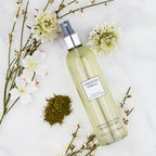 Vera Wang fragrance mist bottle with green tea and pear blossom label