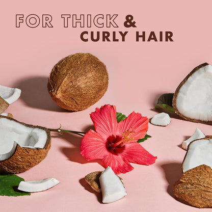 Studio shot emphasizing the natural hair care benefits written on the authentic SheaMoisture curl defining bottles