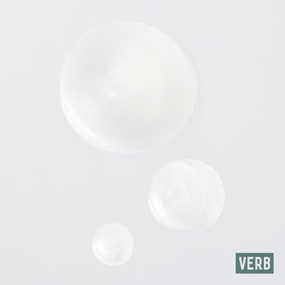 Texture shot of the lightweight Verb Ghost Shampoo and Conditioner liquids on a flat surface