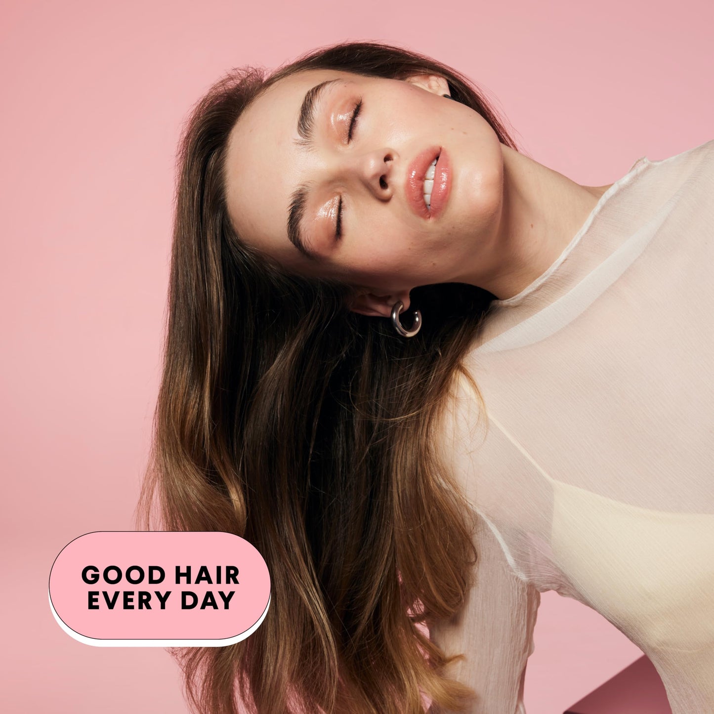 Close up view of the convenient pump top on the pink Monday Haircare shampoo bottle