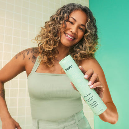 Amika sulfate free repair shampoo for targeted bond strengthening and daily cleansing.