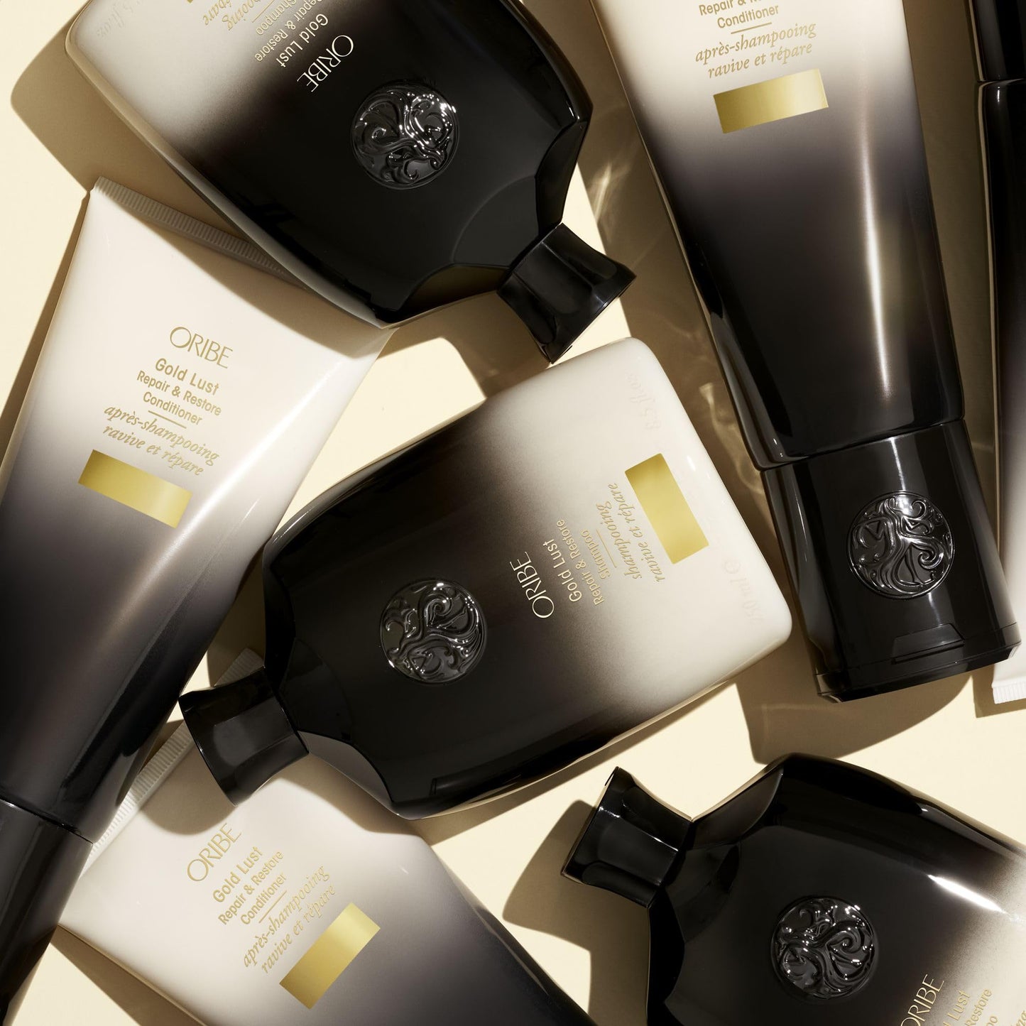 Side profile of the 250ml Oribe Gold Lust shampoo container showing authentic batch code information.