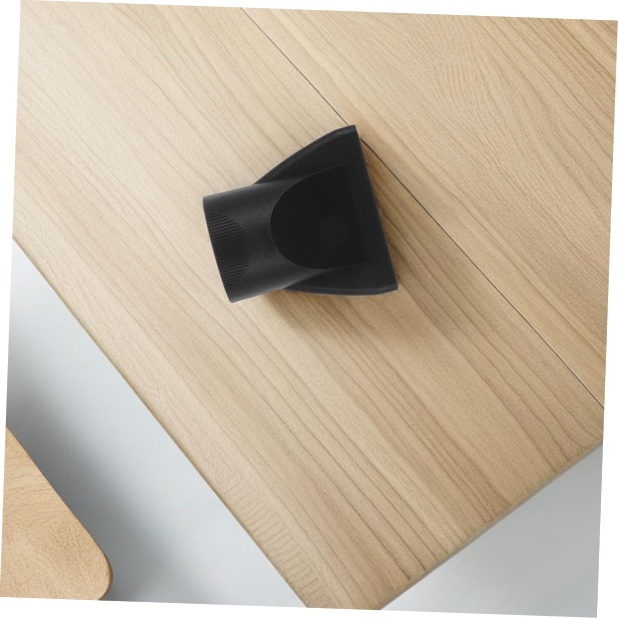 The premium black replacement concentrator nozzle displayed alone to show the smooth interior air channel.