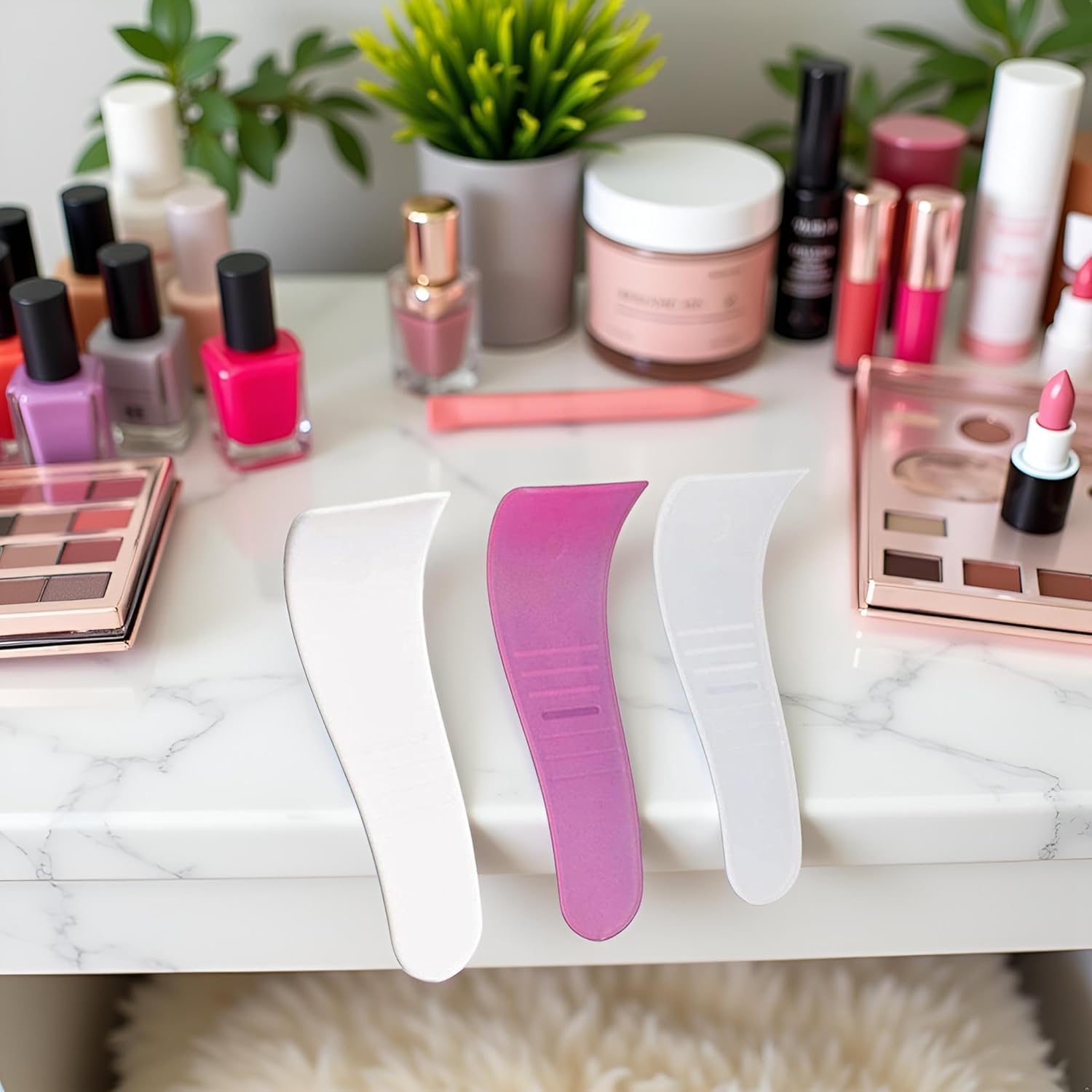 Five pieces of colorful depilatory cream applicators arranged neatly on a clean background.