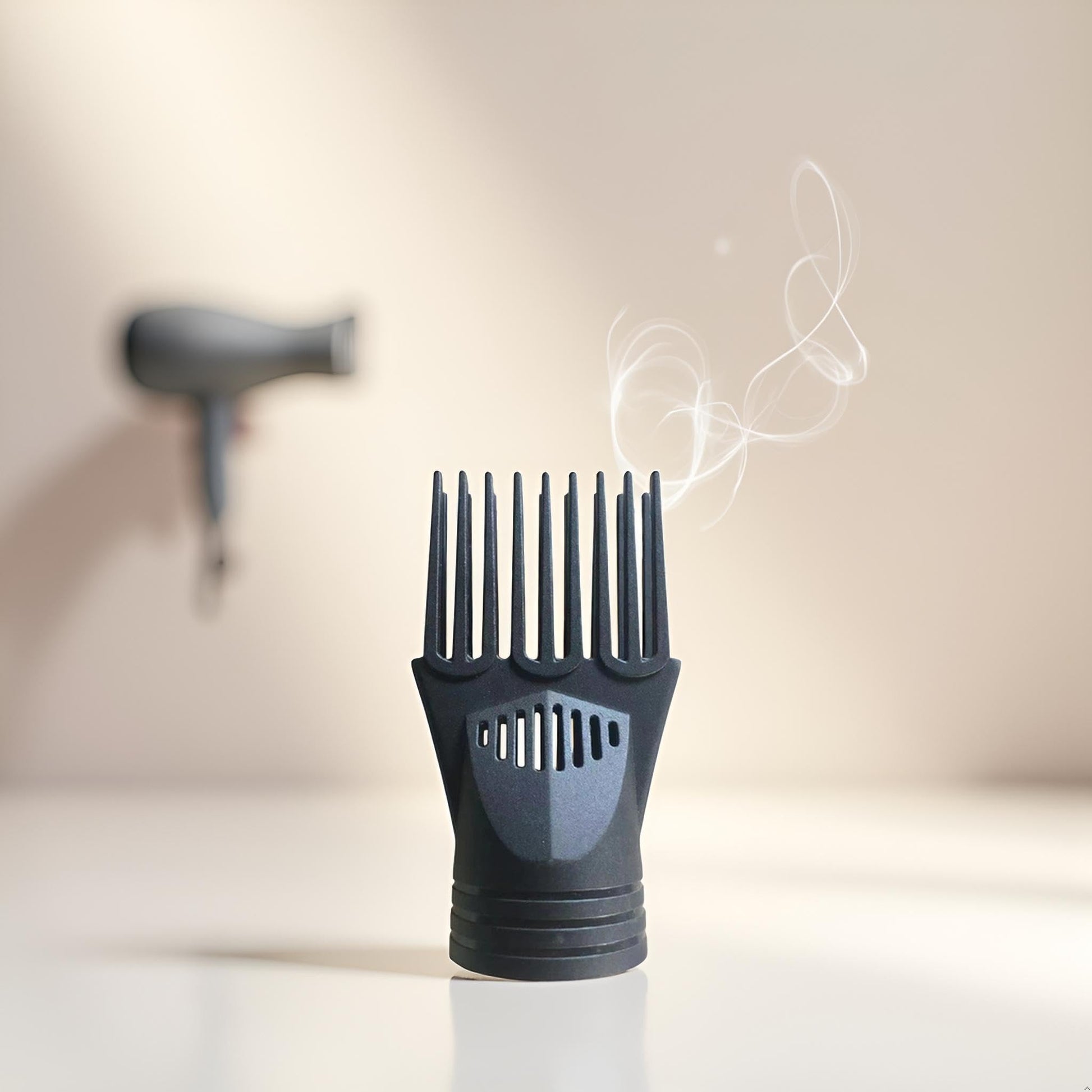Two black plastic hair dryer comb nozzles side by side