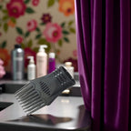 Juroicessry black hair styling nozzle attached to dryer