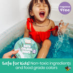 Children playing with colored water in bathtub