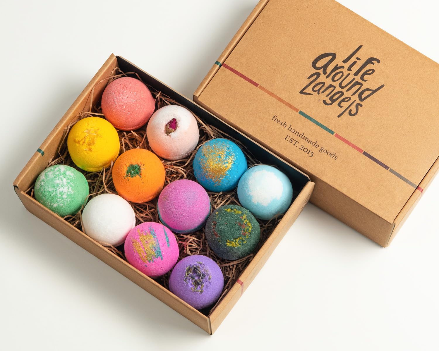 LifeAround2Angels shea and cocoa butter infused bath bomb dissolving in warm water with vibrant colors