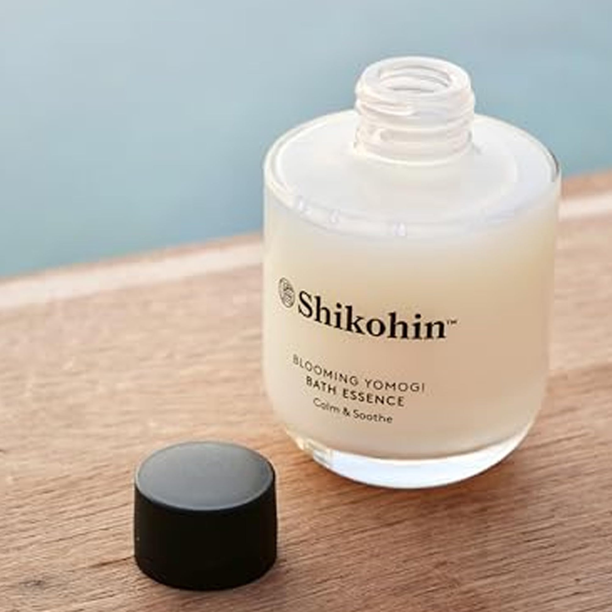 Back label of SHIKOHIN yomogi bath oil showing directions and key botanicals
