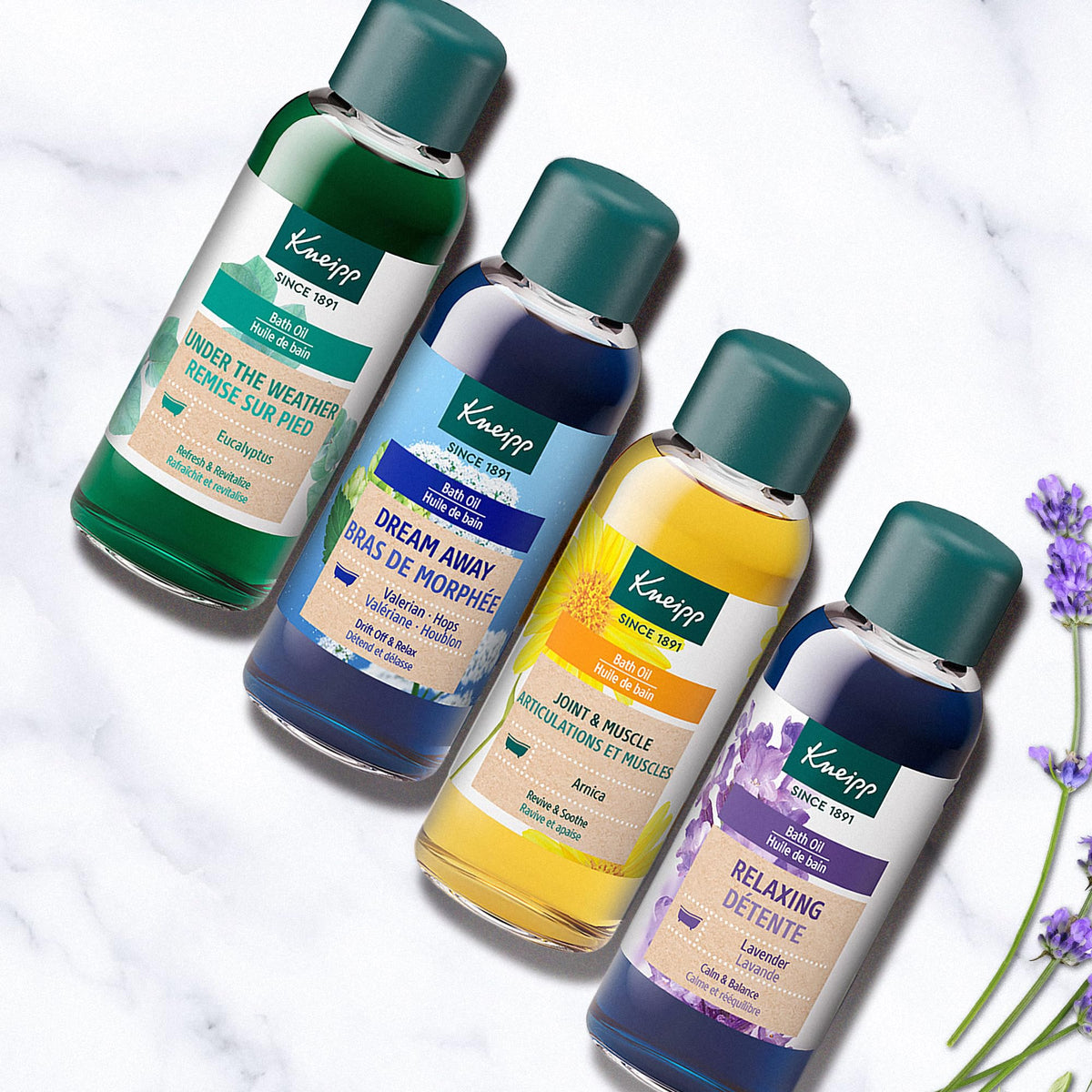 Close-up view of individual botanical essential oil bottles from the set