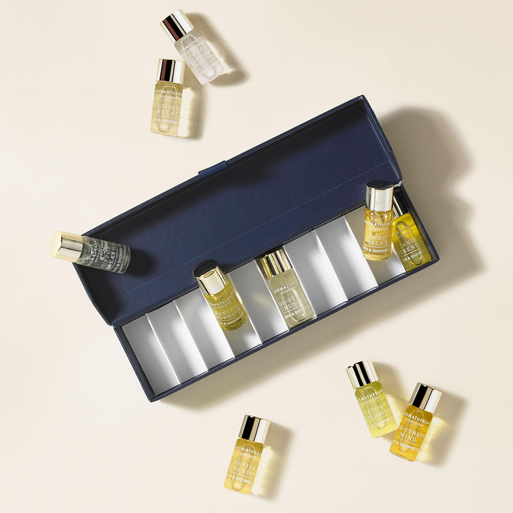 Detailed view of travel-sized essential oil bottles for bath and shower