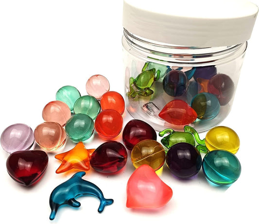 Mixed color and unique shaped essential oil spa pearls dissolving in warm bathwater